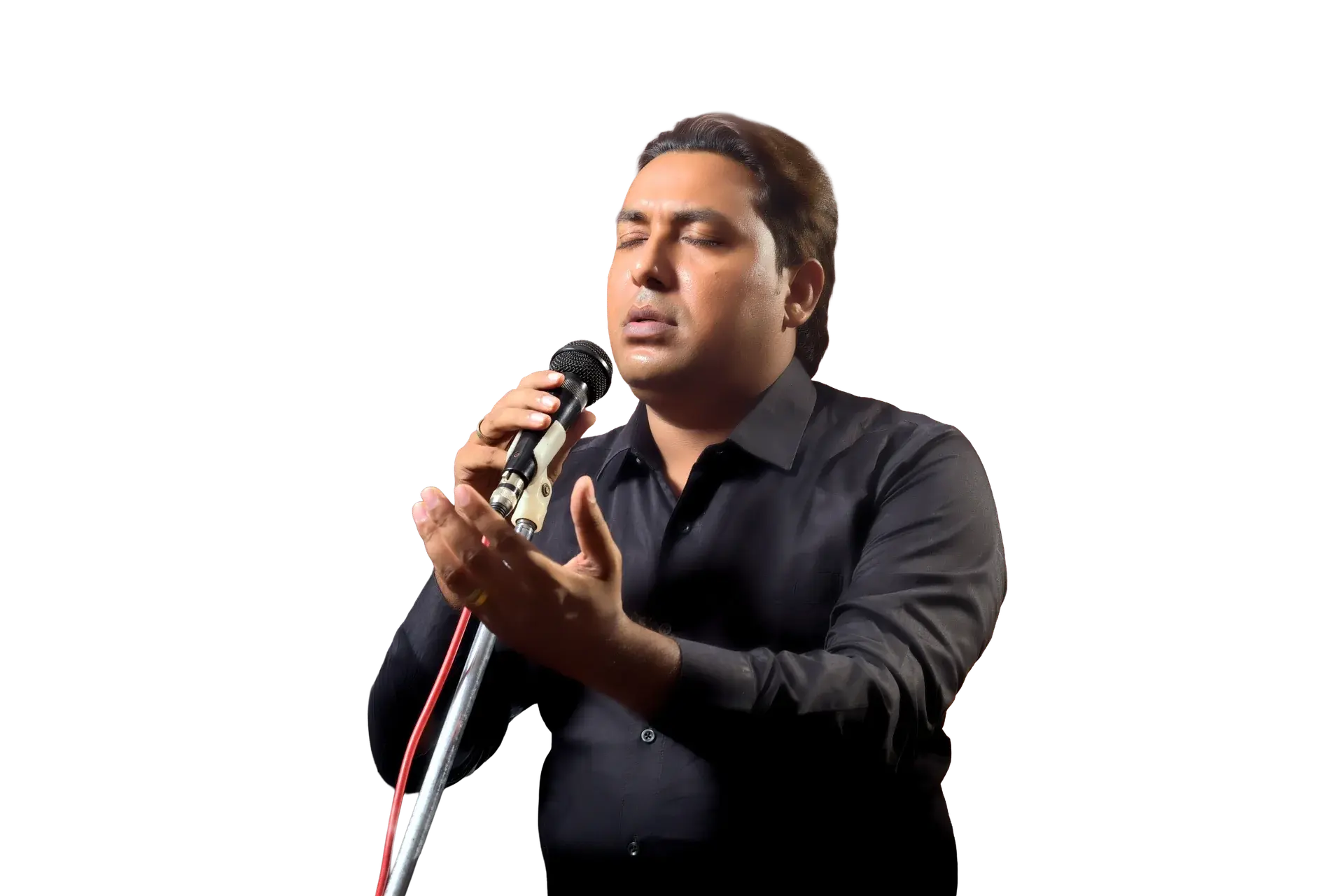 Pastor Victor M. Sidhu composing worship music on an acoustic guitar